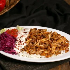 Plate of rotating spit döner meat with sides